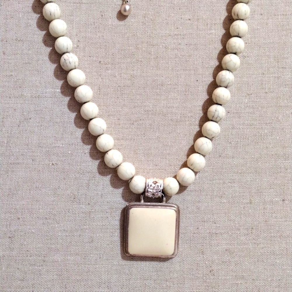 George pendant and beads necklace.